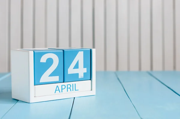 April 24th. Image of april 24 wooden color calendar on white background.  Spring day, empty space for text. World Immunization Week