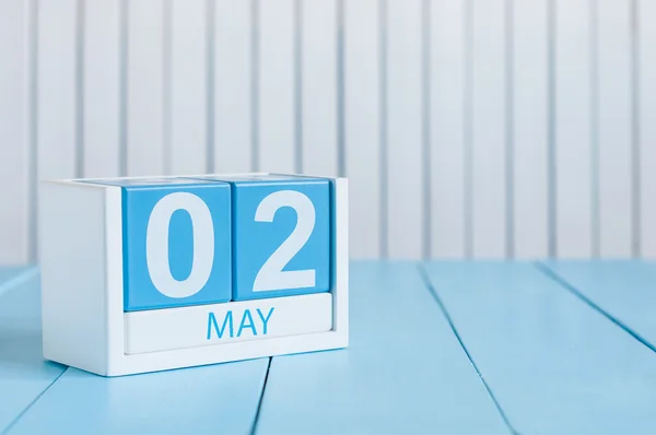 May 2nd. Image of may 2 wooden color calendar on white background.  Spring day, empty space for text.  last spring month