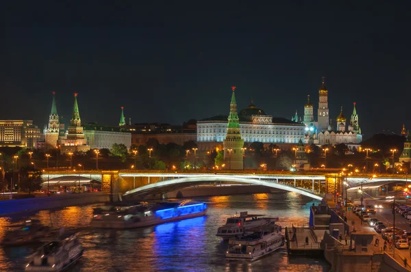 Evening in Moscow. Night view of the Kremlin and bridge illuminated by lights.