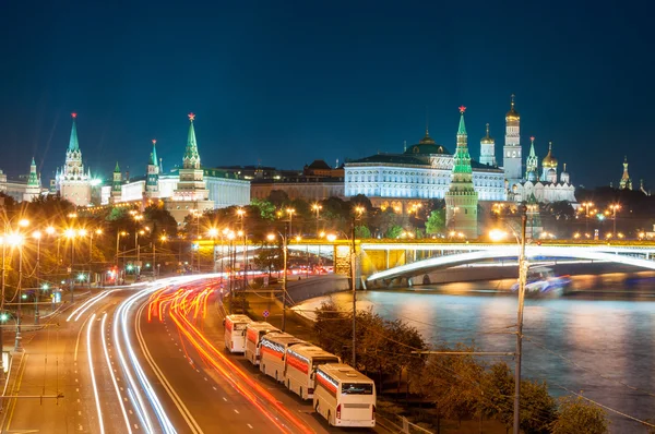 Evening in Moscow. Night view of the Kremlin and bridge illuminated by lights.