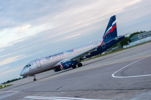 KIEV, UKRAINE - JULY 10, 2015: Aeroflots  SSJ 195-b taxis to teminal at KBP Airport on January 12, 2014. Aeroflot is flag carrier and largest airline of the Russian Federation.