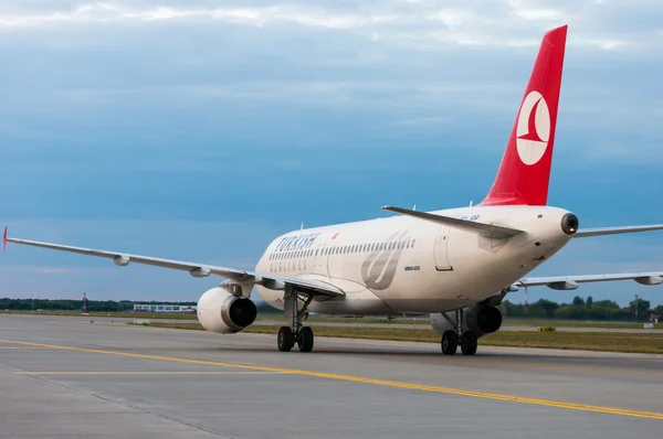 KIEV, UKRAINE - JULY 10, 2015: Turkish Airlines Airbus A320 at Borispol International Airport, Kiev, Ukraine. TurkisH Airline has over 18,000 employees and a fleet of 261.