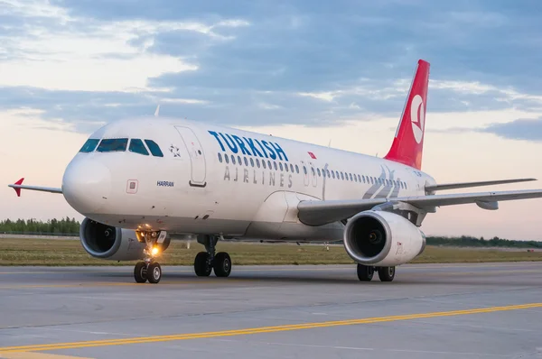 KIEV, UKRAINE - JULY 10, 2015: Turkish Airlines Airbus A320 at Borispol International Airport, Kiev, Ukraine. TurkisH Airline has over 18,000 employees and a fleet of 261.