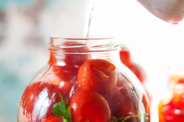 Canning tomatoes. fresh vegetables and spices. cooking the recipe. Canned tomato - good winter vegeterian food. Soft focus