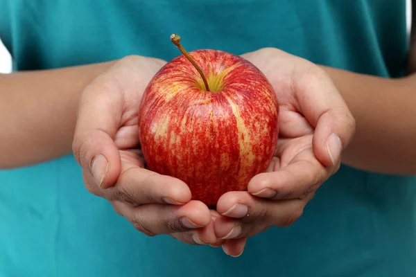 Closeup of hands holding fresh red apple