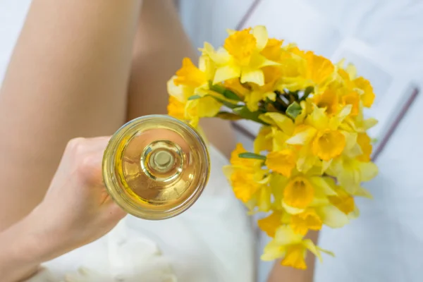 Woman with narcissus flower