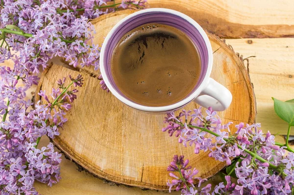 Cup of coffee and spring flowers