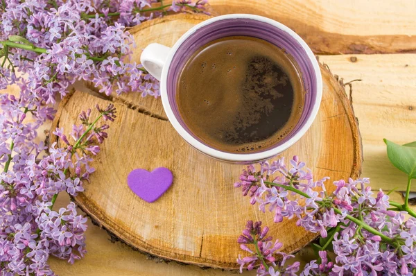 Cup of coffee and spring flowers