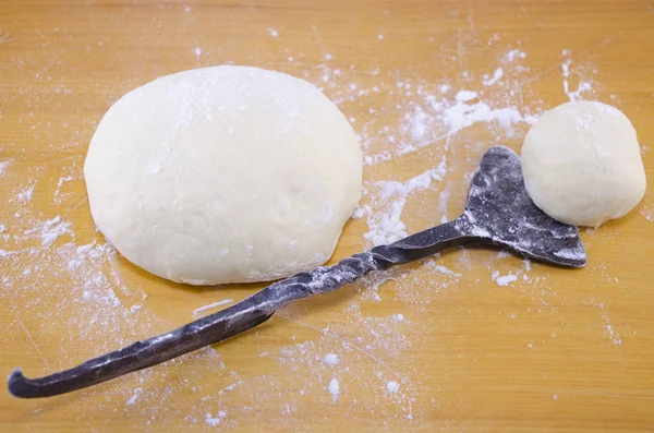 Hand kneaded dough and an old-style dough cutter