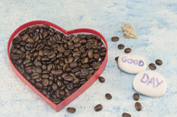 Heart shaped box filled with coffee beans