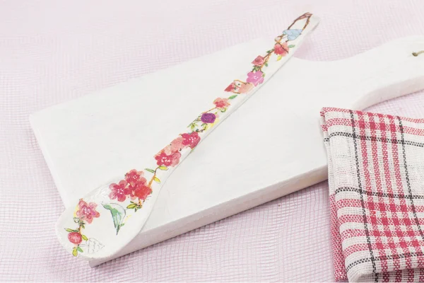 Decoupage decorated kitchen tools with flower pattern