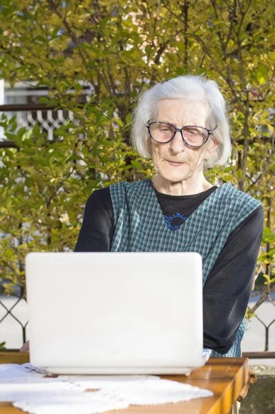 90 years old woman having a video call