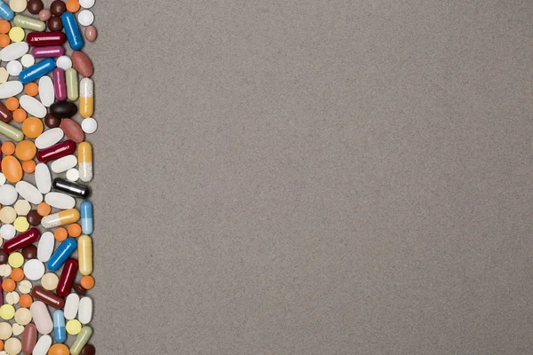 Blank page with border of colorful pills