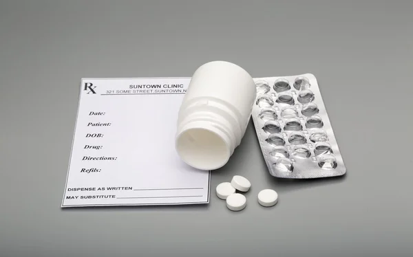 Prescription blank and open pill bottle