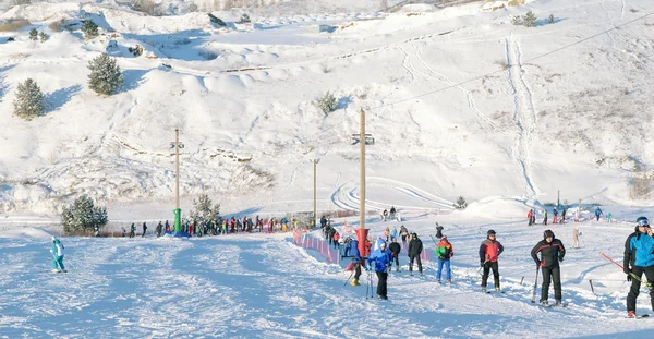 People in the queue for the lift in the ski park \