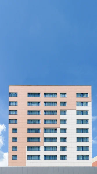 Modern high-rise building with blue windows and walls
