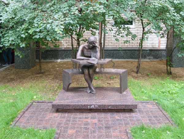 Bronze sculpture of a student sitting at his desk, in patio of the Moscow State Linguistic University