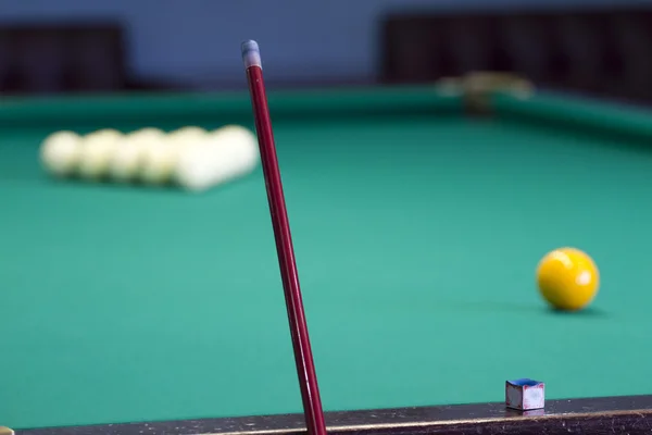 Large pool table for Russian billiards with balls on the table.