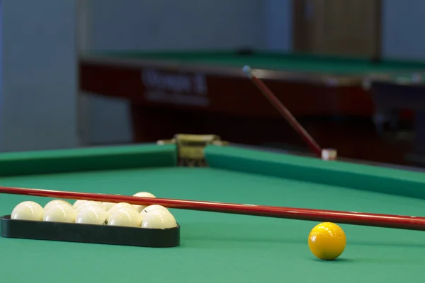 Large pool table for Russian billiards with balls on the table.