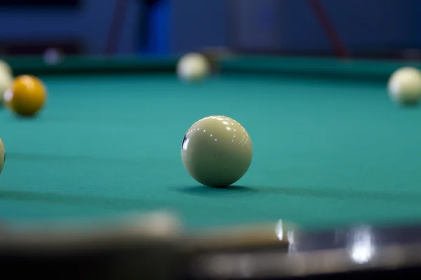 Large pool table for Russian billiards with balls on the table.