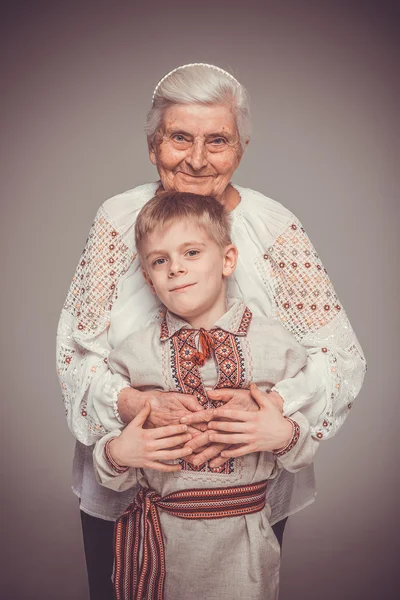 Grandmother with grandson. Grandmother hugging her grandson.