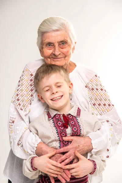 Grandmother with grandson. Grandmother hugging her grandson.