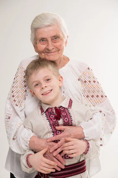 Grandmother with grandson. Grandmother hugging her grandson.