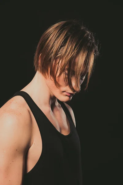 Model. A young guy in a black shirt and jeans.