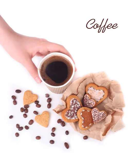 Glass of coffee and beautiful cookies in the form of hearts on a white background with space for the text. Top view.