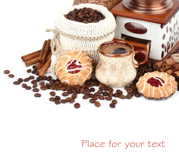 Cup of fragrant coffee, the coffee grinder, coffee grains in a knitted bag and cookies on a white background.