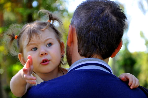 The daughter of my father\'s hand pointing at something