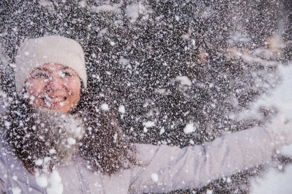 Smile Girl throws snow