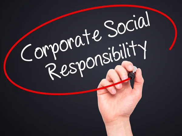 Man Hand writing Corporate Social Responsibility with black mark