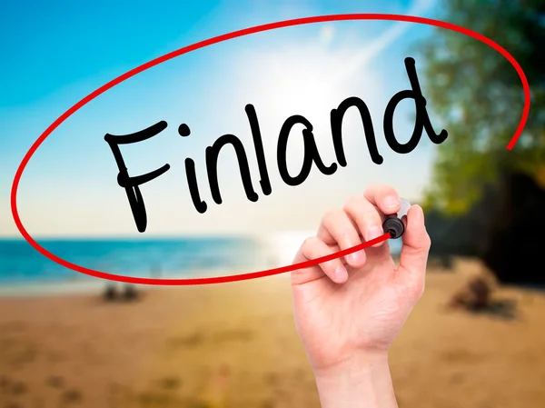 Man Hand writing Finland with black marker on visual screen.