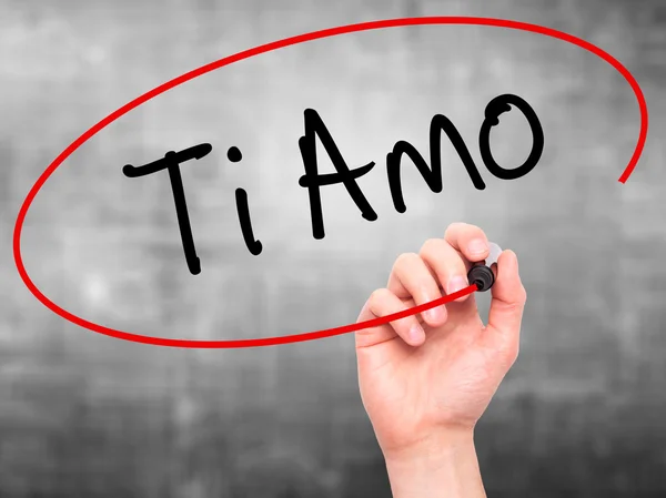 Man Hand writing Ti Amo (I Love You In Italian) with black marke