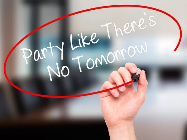 Man Hand writing Party Like There\'s No Tomorrow with black marke