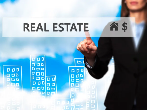 Real estate agent pressing button on virtual screen.