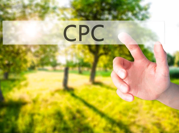 CPC - Hand pressing a button on blurred background concept on vi