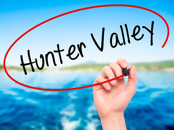 Man Hand writing Hunter Valley  with black marker on visual scre