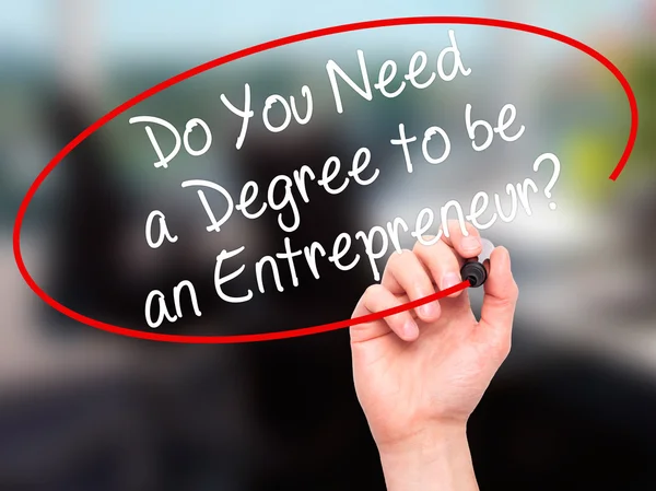 Man Hand writing Do You Need a Degree to be an Entrepreneur? wit