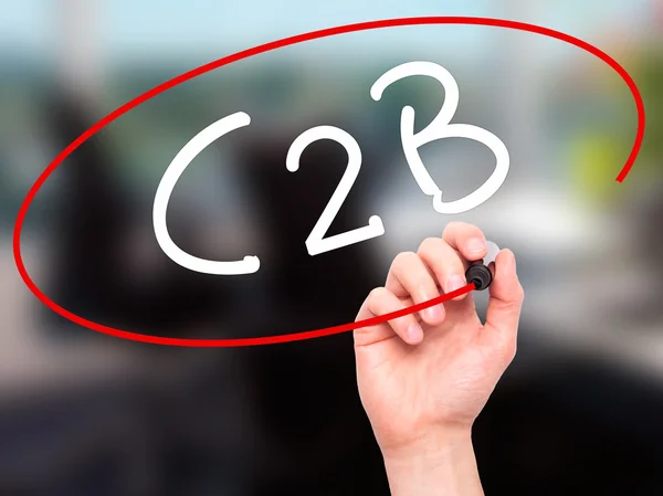 Man Hand writing C2B with black marker on visual screen