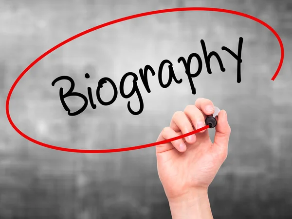 Man Hand writing Biography  with black marker on visual screen