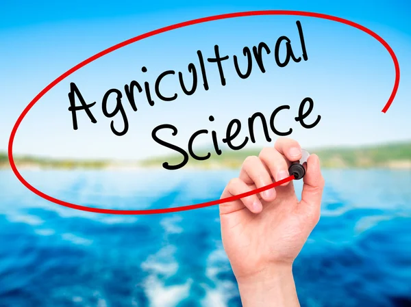 Man Hand writing Agricultural Science with black marker on visua