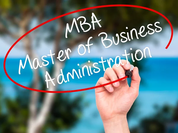 Man Hand writing MBA - Master of Business Administration with bl