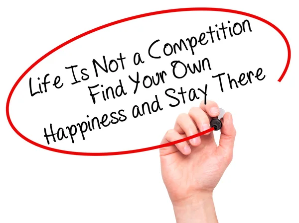 Man Hand writing Life Is Not a Competition Find Your Own Happine