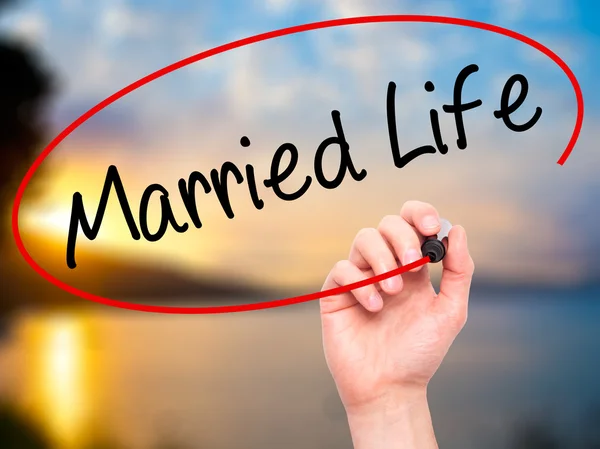 Man Hand writing Married Life with black marker on visual screen