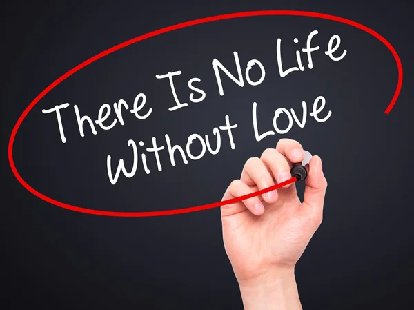 Man Hand writing There Is No Life Without Love with black marker