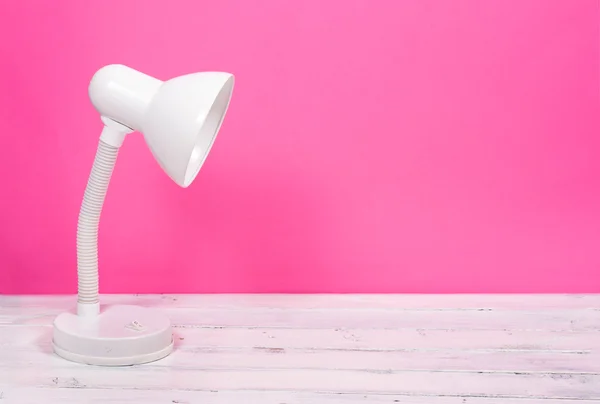 White lamp on pink background