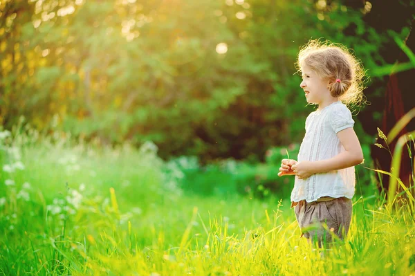 Cute happy 5 years old child girl on the walk in summer