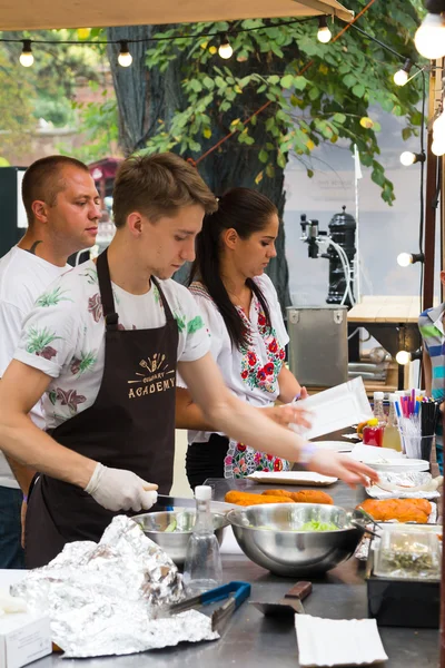 Odesa, Ukraine - August 06, 2016: chef is cooking meat on the street food event